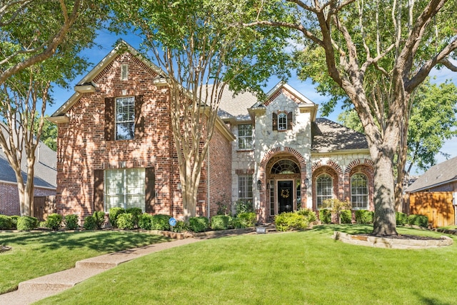 3117 Robert Dr, Richardson, TX 75082 - tudor home featuring a front lawn and brick siding