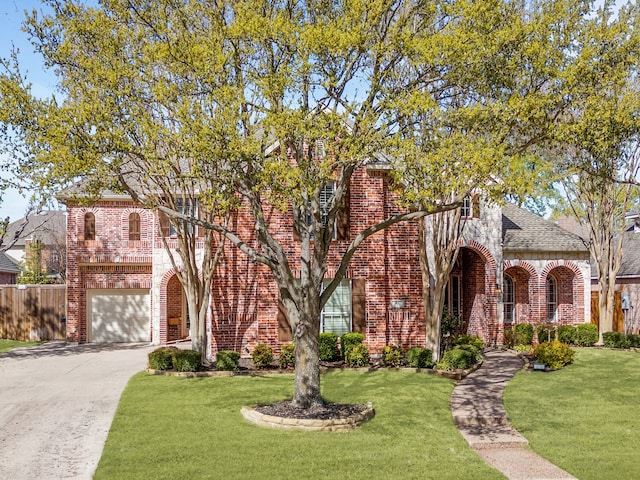3117 Robert Dr, Richardson, TX 75082 - view of front of house with brick siding, a front yard, driveway, and a garage