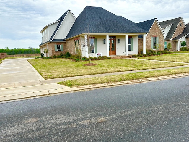 637 Caledonia Dr, Bossier City, LA 71111 - view of front facade with brick siding, a front lawn, concrete driveway, and roof with shingles