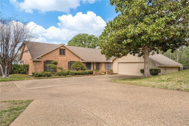 3709 Windmill Hill St, Waco, TX 76710 - view of front of house with brick siding, driveway, roof with shingles, and an attached garage