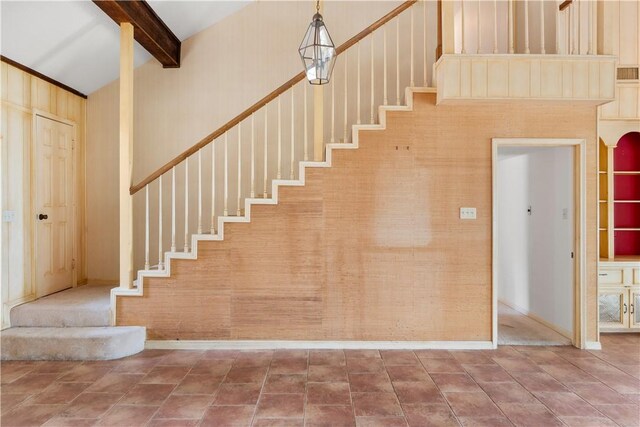 3709 Windmill Hill St, Waco, TX 76710 - stairway with tile patterned floors, beam ceiling, and baseboards