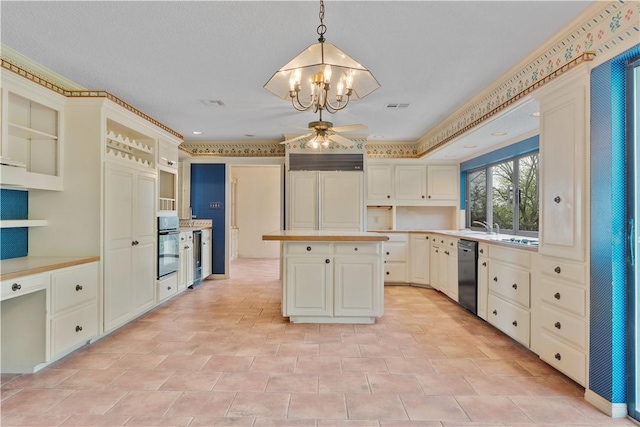 3709 Windmill Hill St, Waco, TX 76710 - kitchen featuring light countertops, ceiling fan with notable chandelier, a kitchen island, visible vents, and black appliances