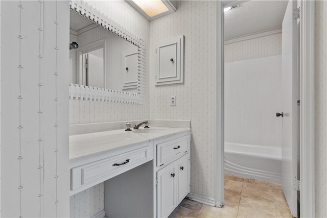 3709 Windmill Hill St, Waco, TX 76710 - bathroom with tile patterned floors, wallpapered walls, and vanity