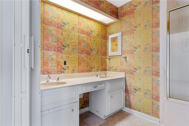 3709 Windmill Hill St, Waco, TX 76710 - full bathroom featuring double vanity, baseboards, a sink, and tile patterned flooring