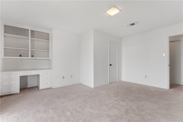 3709 Windmill Hill St, Waco, TX 76710 - interior space with built in desk, light carpet, and visible vents