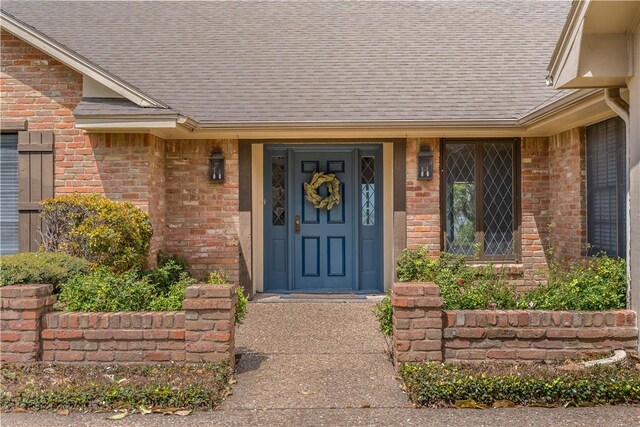 3709 Windmill Hill St, Waco, TX 76710 - property entrance featuring brick siding and a shingled roof
