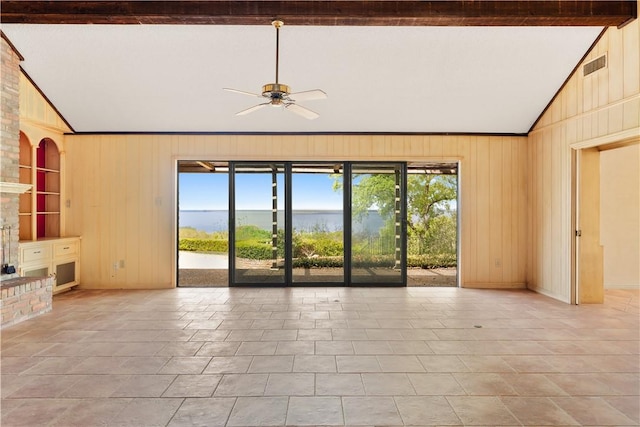 3709 Windmill Hill St, Waco, TX 76710 - unfurnished living room featuring vaulted ceiling, visible vents, wood walls, and a ceiling fan