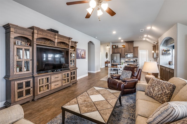 1001 Hodge St, Mckinney, TX 75071 - living room with a ceiling fan, arched walkways, lofted ceiling, baseboards, and dark wood finished floors