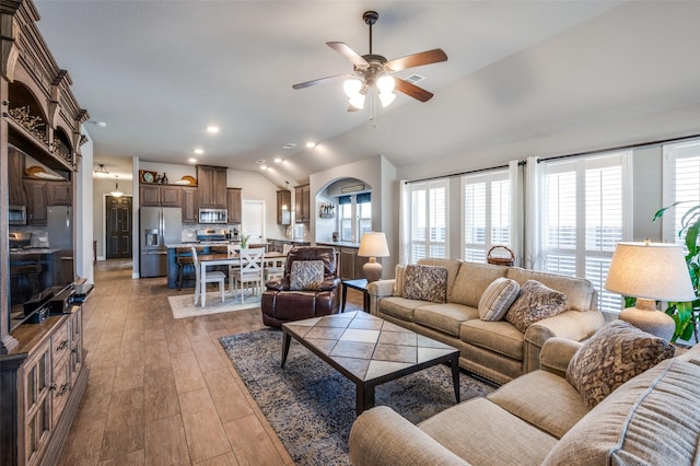 1001 Hodge St, Mckinney, TX 75071 - living area featuring vaulted ceiling, light wood finished floors, healthy amount of natural light, a ceiling fan, and recessed lighting