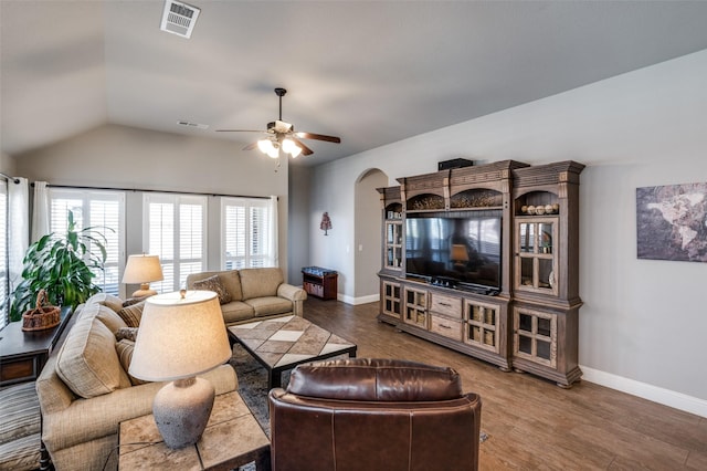 1001 Hodge St, Mckinney, TX 75071 - living room featuring ceiling fan, lofted ceiling, wood finished floors, arched walkways, and baseboards