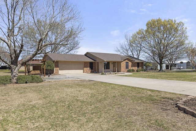 view of front of property with a front yard, an attached garage, brick siding, and concrete driveway
