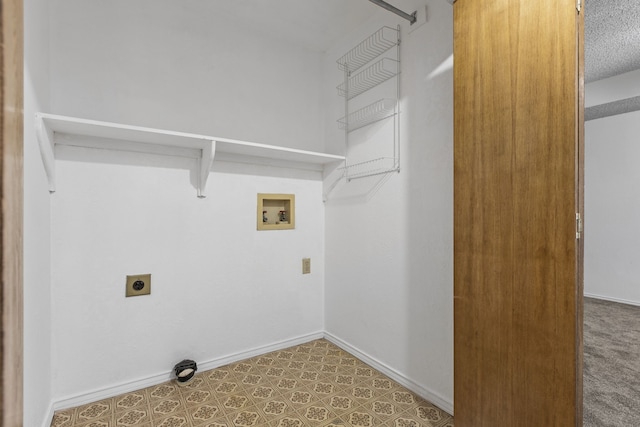 laundry room with baseboards, washer hookup, hookup for an electric dryer, and laundry area