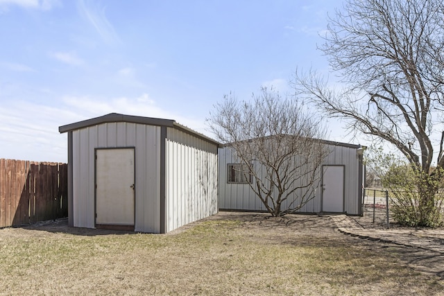 view of shed with fence