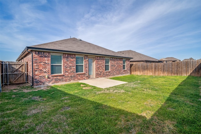 2430 Rosharon Dr, Forney, TX 75126 - back of house featuring a fenced backyard, brick siding, a yard, and a patio area