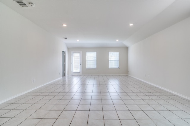 2430 Rosharon Dr, Forney, TX 75126 - spare room with vaulted ceiling, recessed lighting, light tile patterned floors, baseboards, and visible vents