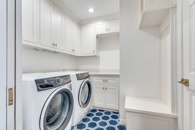 laundry room featuring tile patterned floors, independent washer and dryer, recessed lighting, and cabinet space