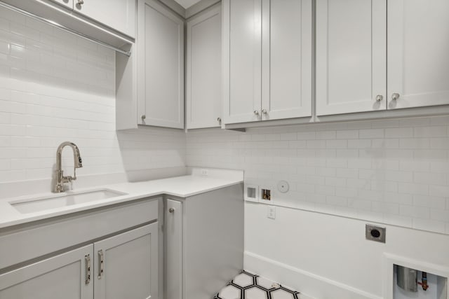 9518 Still Creek Ln, Dallas, TX 75238 - laundry area with electric dryer hookup, cabinet space, hookup for a gas dryer, and washer hookup