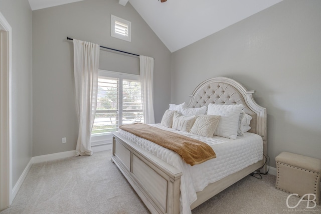 bedroom featuring high vaulted ceiling, baseboards, light colored carpet, and multiple windows