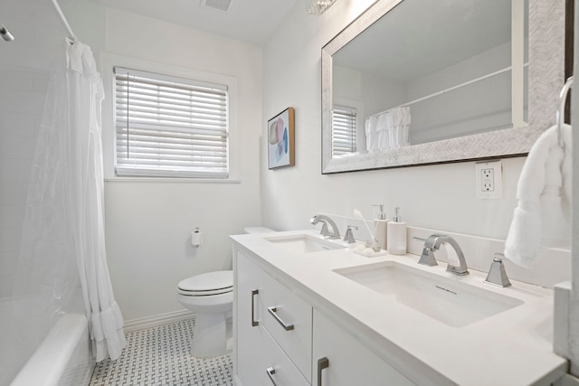 full bath featuring toilet, a sink, baseboards, and visible vents