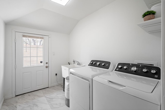 clothes washing area with marble finish floor, baseboards, separate washer and dryer, and laundry area