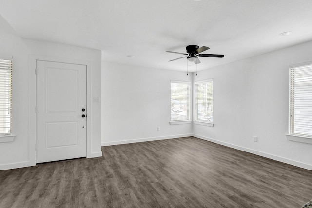 2616 S Fannin Ave, Denison, TX 75020 - unfurnished room with baseboards, dark wood-style flooring, and a ceiling fan