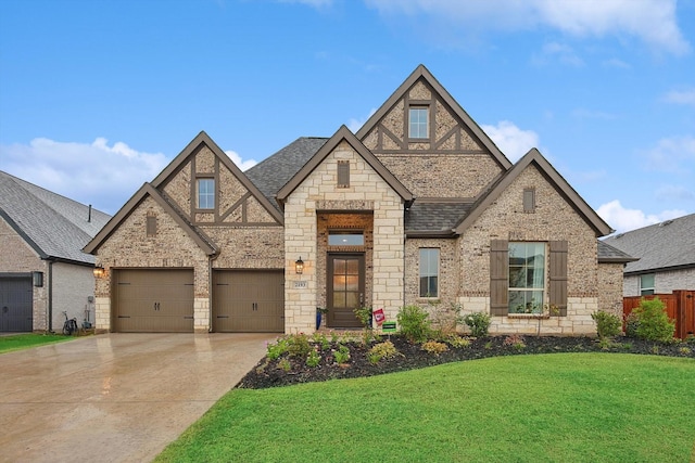 2193 Cloverfern Way, Haslet, TX 76052 - view of front of property featuring a front yard, stone siding, roof with shingles, concrete driveway, and fence