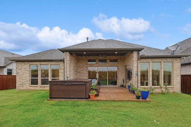 2193 Cloverfern Way, Haslet, TX 76052 - back of property featuring a patio, a fenced backyard, a ceiling fan, brick siding, and a hot tub