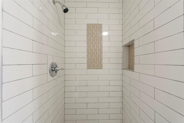 full bath featuring tiled shower