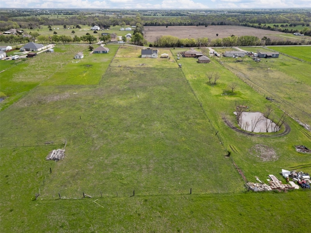 birds eye view of property featuring a rural view