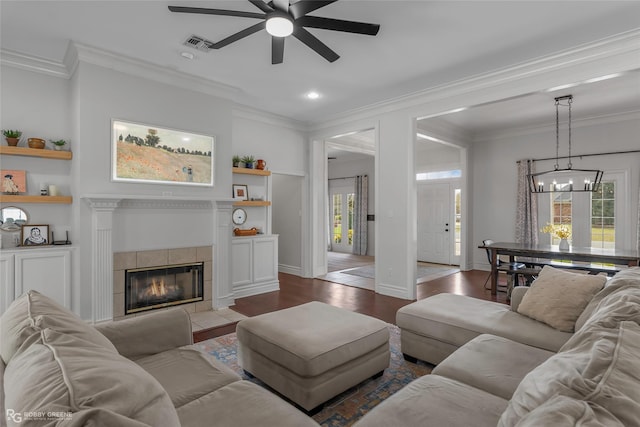 521 Lovers Lndg, Bossier City, LA 71111 - living room featuring wood finished floors, visible vents, ceiling fan with notable chandelier, and crown molding