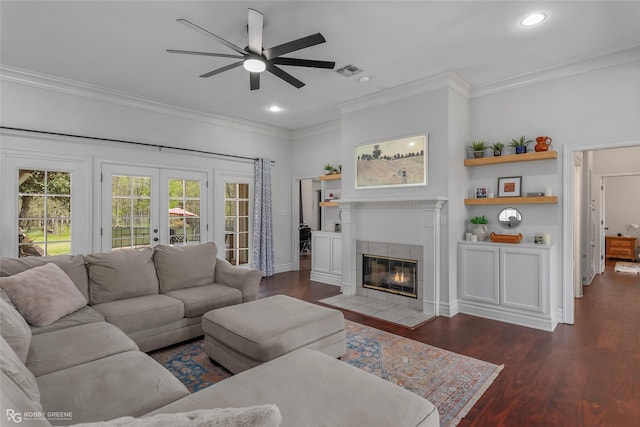 521 Lovers Lndg, Bossier City, LA 71111 - living room featuring visible vents, ornamental molding, wood finished floors, a tiled fireplace, and a ceiling fan