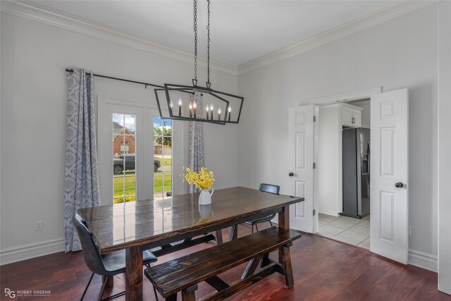 521 Lovers Lndg, Bossier City, LA 71111 - dining space with baseboards, ornamental molding, wood finished floors, and a notable chandelier