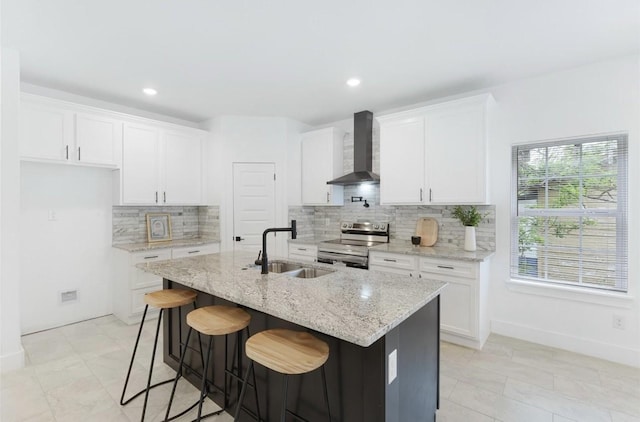 318 Whitworth St, Sulphur Springs, TX 75482 - kitchen featuring a sink, white cabinetry, wall chimney exhaust hood, decorative backsplash, and stainless steel electric range oven