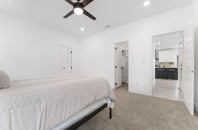 318 Whitworth St, Sulphur Springs, TX 75482 - bedroom with a spacious closet, recessed lighting, light colored carpet, and visible vents