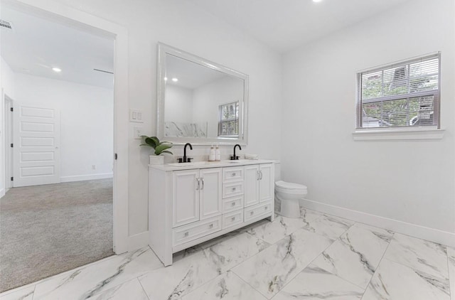 318 Whitworth St, Sulphur Springs, TX 75482 - bathroom with plenty of natural light, baseboards, and a sink