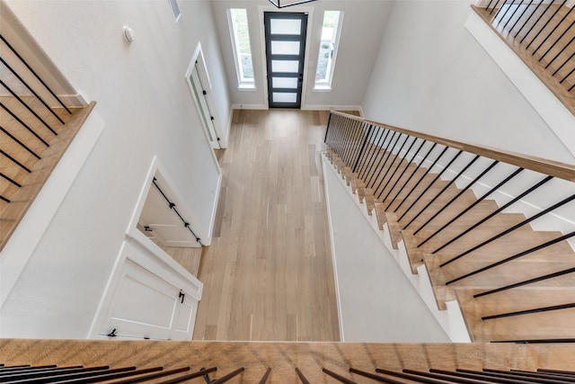 entrance foyer featuring wood finished floors and stairway