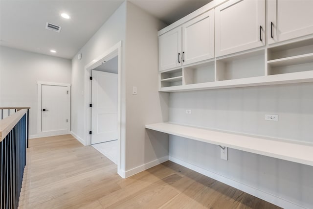 hall with baseboards, visible vents, recessed lighting, and light wood-type flooring