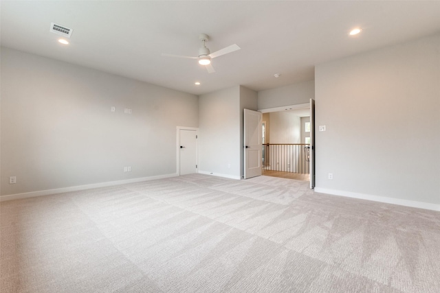 spare room with recessed lighting, baseboards, ceiling fan, and visible vents
