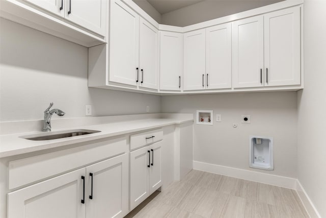 laundry room with hookup for a gas dryer, a sink, washer hookup, electric dryer hookup, and cabinet space