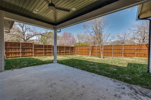 view of yard with ceiling fan, a fenced backyard, and a patio area