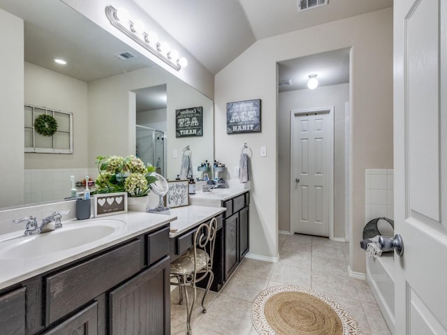 7913 Wildwest Dr, Fort Worth, TX 76131 - bathroom featuring vanity, a stall shower, tile patterned floors, lofted ceiling, and a tub