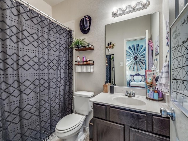 7913 Wildwest Dr, Fort Worth, TX 76131 - bathroom featuring toilet, vanity, a textured wall, and a shower with shower curtain