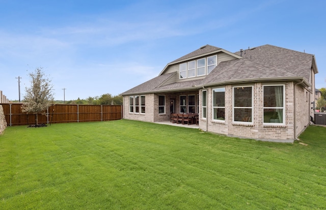2621 Landmark Dr, Celina, TX 75009 - back of property featuring a fenced backyard, brick siding, a lawn, and a patio