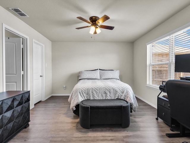 6348 Sloop St, Fort Worth, TX 76179 - bedroom featuring wood finished floors, baseboards, and visible vents