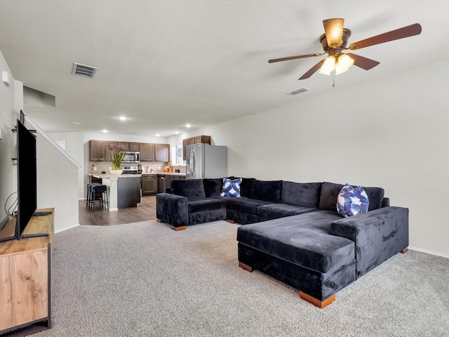 6348 Sloop St, Fort Worth, TX 76179 - living room featuring light colored carpet, visible vents, and ceiling fan