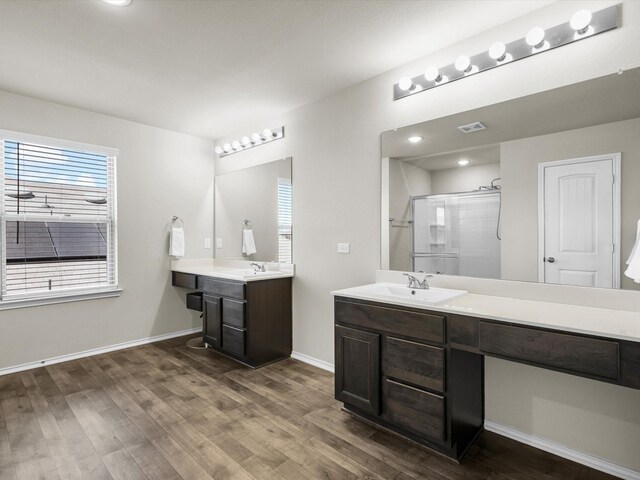 6348 Sloop St, Fort Worth, TX 76179 - bathroom featuring a stall shower, baseboards, and wood finished floors