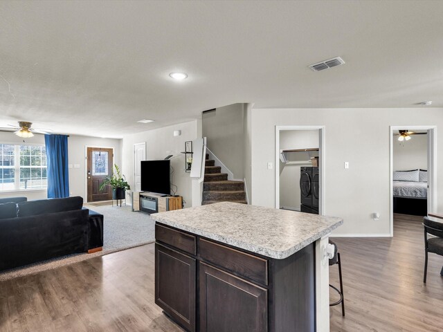 6348 Sloop St, Fort Worth, TX 76179 - kitchen with light countertops, visible vents, ceiling fan, open floor plan, and washer and clothes dryer