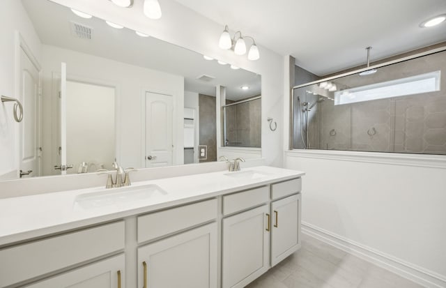 244 Kistler Dr, Little Elm, TX 76227 - full bath with a stall shower, double vanity, and recessed lighting
