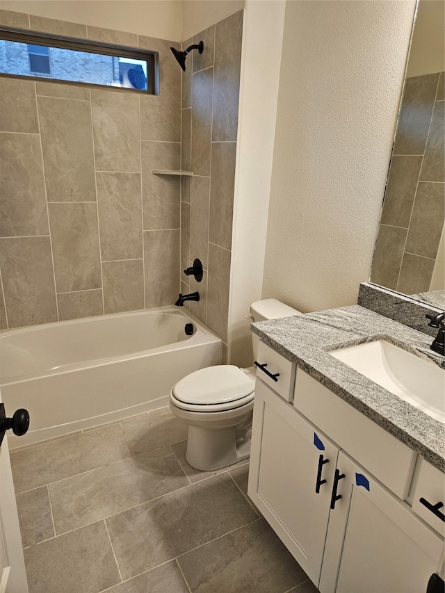 full bath with toilet, vanity, and shower / bath combination