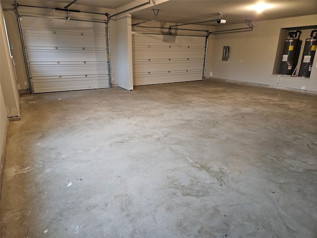 garage featuring water heater, a garage door opener, and electric panel